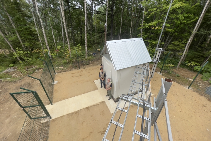 AS92 site: security fence, cable tray and borehole enclosure - a deep hole or well that is drilled into the ground to house seismic sensors or seismometers